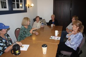Caregivers support each other in an intimate setting